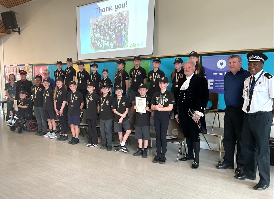 Peasedown St John Mini-Police graduate at a special school assembly with representatives from the local community in attendance.